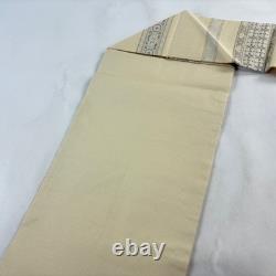 Beige silk semi-formal obi belt with Karakusa and Dan Shima golden thread style
